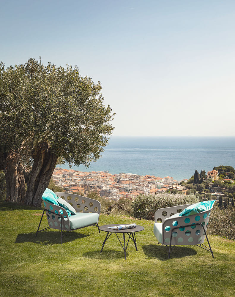Bolle lounge armchair in light blue, design Paola Navone